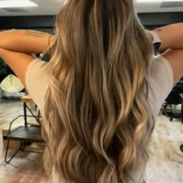 Hair work by Seantel Oliver — sun-kissed light brown waves
