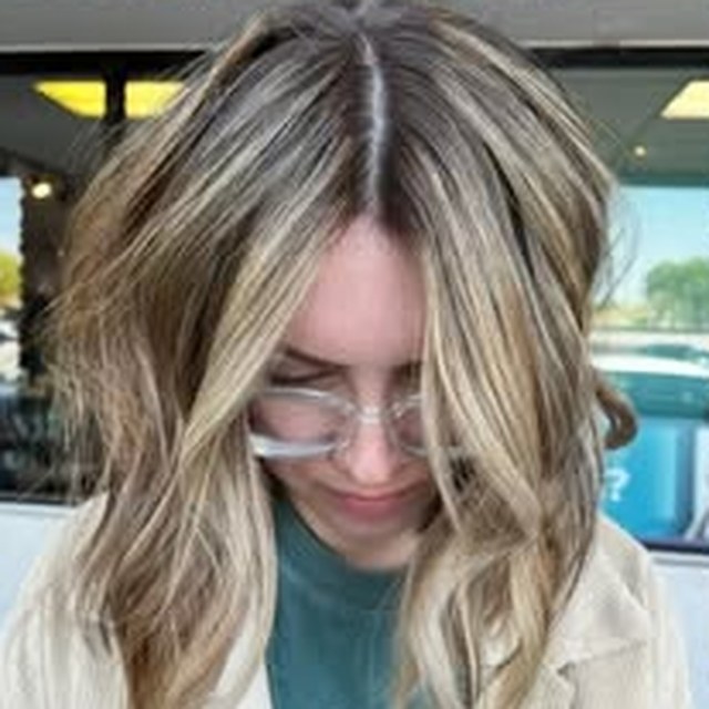 Hair work by Seantel Oliver — face-framing blonde highlights