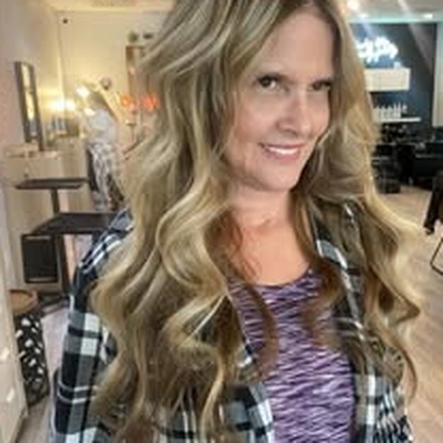Hair work by Seantel Oliver — layered blonde waves in salon